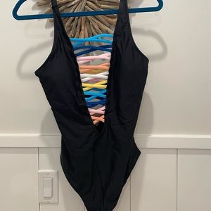 Black low cut one piece with rainbow crisscross